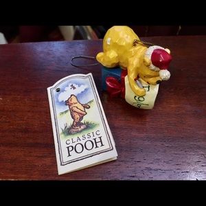 Classic Pooh wrapping a present, resin ornament